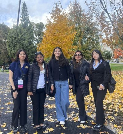 Five women posing for a picture outside the Sacramento Capitol 